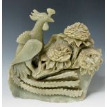 A large jadeite carving of a bird and floral blooms, 34cm high,