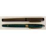 A faux green marble fountain pen with gold plated mounts the cap with gold plated and black enamel