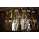 Ribbon, album containing quantity of mainly British medal and award ribbons,