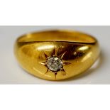 An 18ct yellow gold gentleman's signet ring with gypsy set circular diamond brilliant,