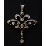 An 18ct yellow gold diamond pendant of stylised leaf design set six old cut diamonds with graduated