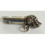 A silver coloured metal dog's head whistle, 7cm long, unmarked,