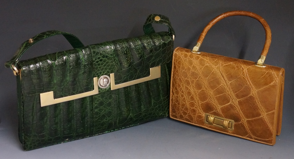 A green stained crocodile handbag with gilt metal fittings,