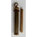 A white metal plated brass quadruple propelling pencil the oval reeded case with four sliding