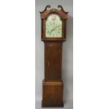 A George III mahogany and oak cottage longcase clock with swan neck pediment terminating in