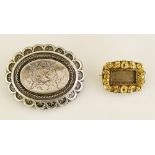 A Victorian shaped oval brooch, the centre foliate engraved, arcaded border with stylised leaves, 3.