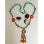 A Chinese turquoise and carnelian necklace of irregular turquoise nuggets and conforming carnelian