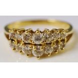 A 14ct yellow gold diamond ring set two rows of seven graduated oval cut diamond brilliants,