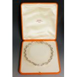 Hermes - a silver oval link necklace with T-bar and circle terminals, 43cm long, 111gms,