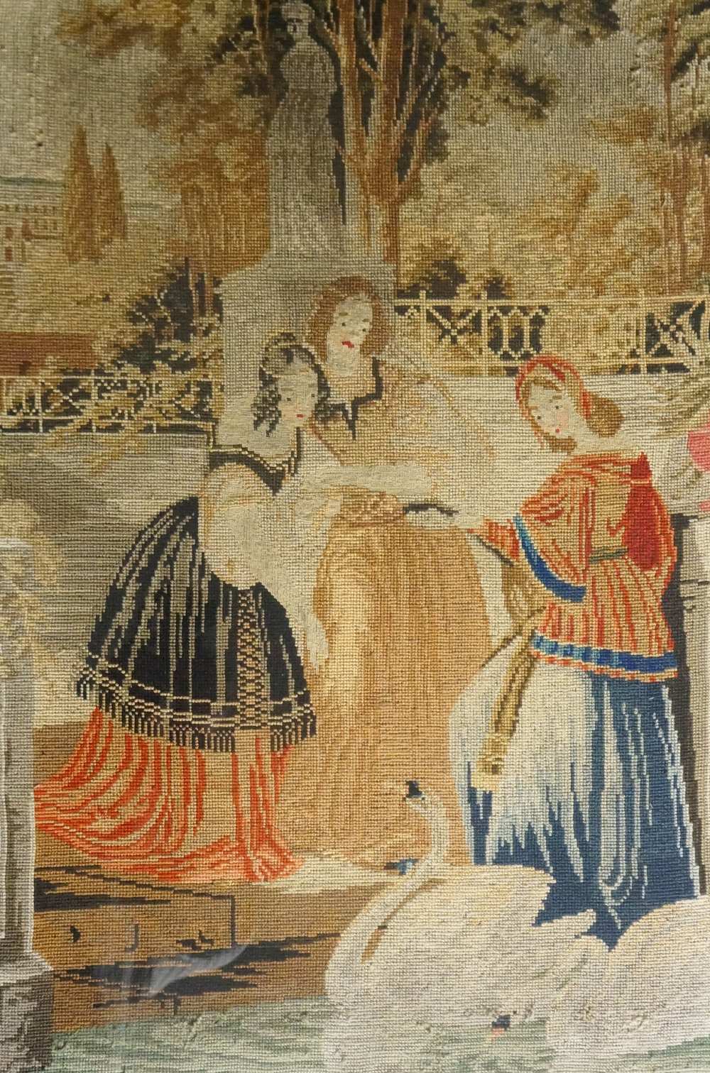 A Victorian needlework picture worked in gros point with three female figures and a swan in a