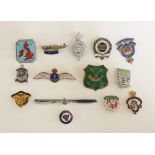 A quantity of badges and brooches etc.