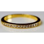 An 18ct yellow gold diamond half eternity ring,