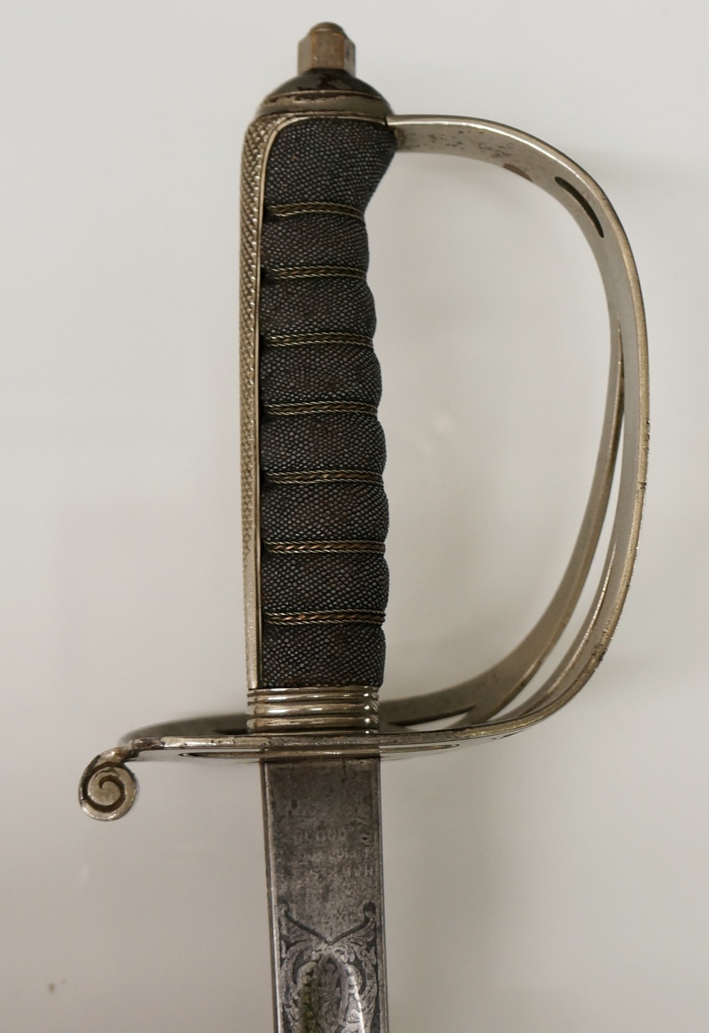 An Edward VII rifle brigade sword with pierced basket, wire bound chequered shagreen grip,