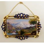 A fine continental enamel rectangular plaque brooch painted with an extensive mountainous landscape