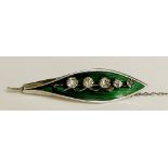 A silver enamel and paste brooch modelled as a leaf bud, 4.