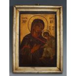 A Russian Orthodox icon of Madonna and Child, oil and gilt on panel, 17.