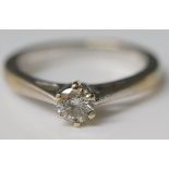 An 18ct white gold solitaire diamond ring, the round cut brilliant approx 0.