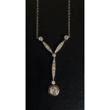 An Edwardian white gold diamond set pendant the collet set circular brilliant approx. 0.