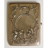 A Russian silver rounded rectangular cigarette case the front with Art Nouveau scrolls,