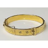 A gold plated "metal cord" belt bracelet,