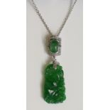 A good jadeite and diamond pendant the jadeite panel finely carved with fruit,