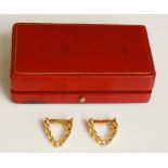 Cartier - a pair of sprung earrings of graduated flattened curb links, 2cm wide,