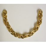 A gold bracelet of oval links with waisted central bars, 24cm long,