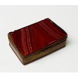 A 19th Century copper mounted red agate box with hinged lid the top and base of finely veined stone,