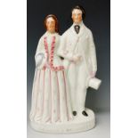 A Staffordshire flat back figure - Prince and Princess, decorated in colours, 40cm high,