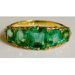 A five stone emerald ring of graduated baguette cut stones approx. 3.