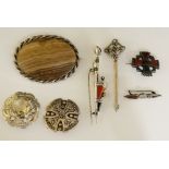 A quantity of Scottish brooches including Celtic knot, Celtic cross, Dirk,