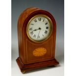 An Edwardian inlaid mahogany arch topped clock with cream dial, painted Roman numerals,