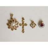 A 9ct gold pearl set "star" pendant, a 9ct gold crucifix,