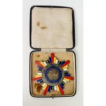 A Chinese enamelled white metal star breast badge, China Republic,