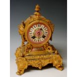 A late 19th Century gilt metal and porcelain mantel clock in the French taste,