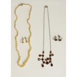 A string of graduated baroque pearls, 46cm long overall, 12gms; a pair of pearl earrings,