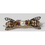 A charming diamond and gem set double bee brooch the bodies with black enamelled bands the wings