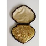 A fine gold sabretache of cartouche shape the hinged lid cast with a seated figure flanked by a