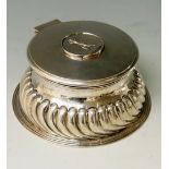 Golfing interest - a silver waisted inkwell, the lower body spirally lobed,