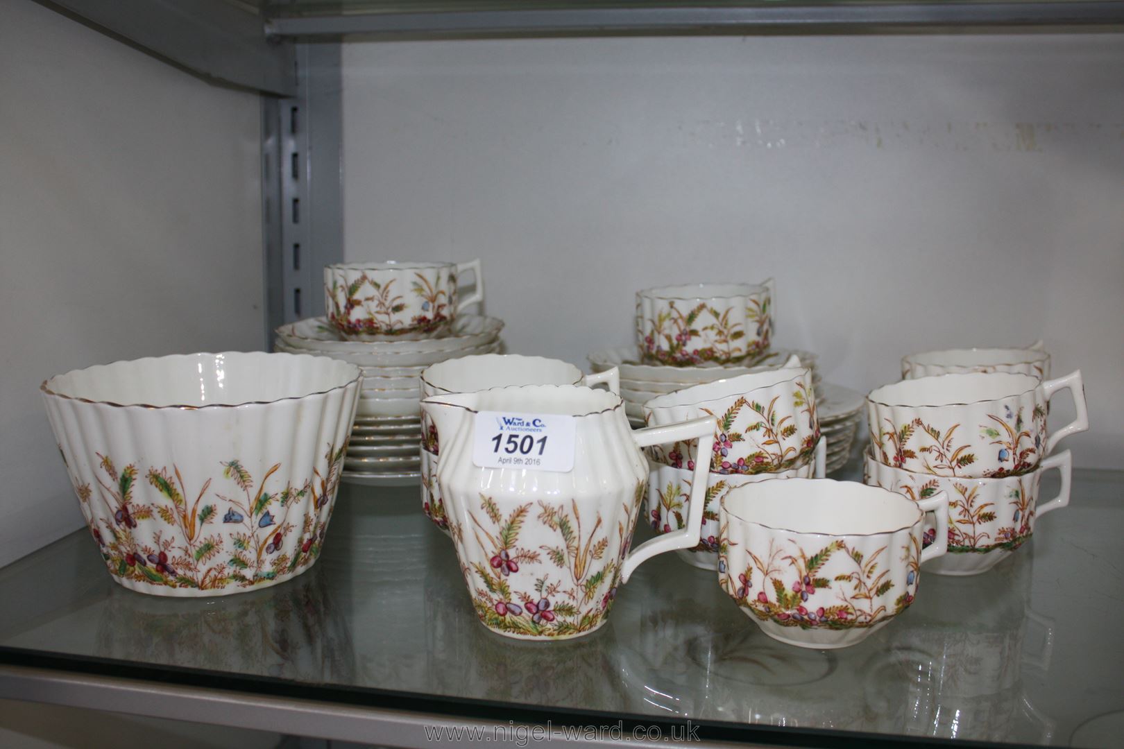 A pretty Teaset including eleven straight sided ridged cups, ten saucers, twelve tea plates,