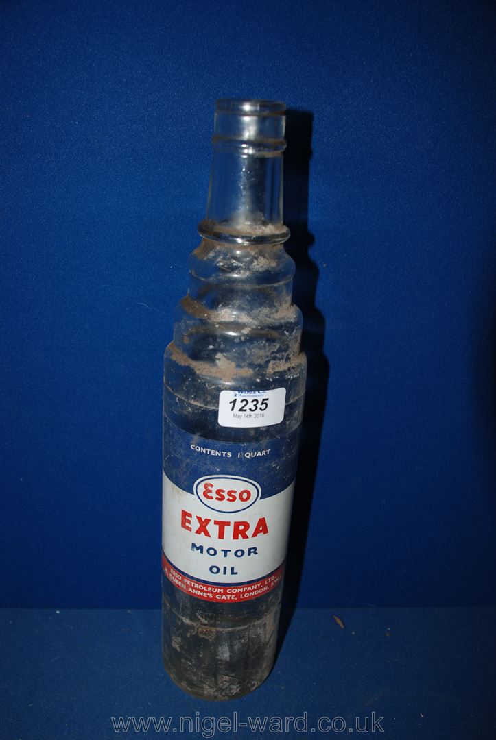 A glass, one quart Esso lubricant Bottle.