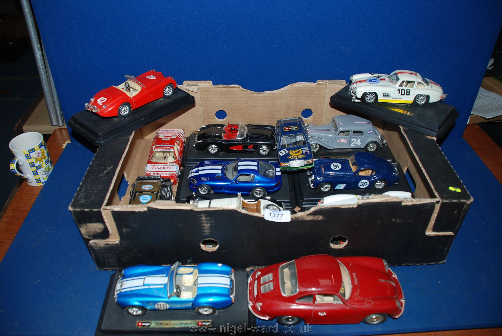 A quantity of 'Burago' model cars for display with metal bodies, opening doors and bonnets,