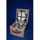 A small square Picnic Hamper for two people.