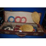 A leather cased Games set including Padder tennis set, quoits, etc.