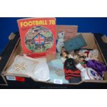 A box of miscellanea including small foreign dolls, cased set of fish knives and forks,