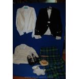 A child's Scottish outfit including kilt, velvet jacket, waistcoat and shoes and sporran.