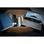 A box of coffee table books: places,