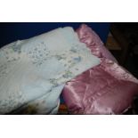 A vintage satin feather filled Eiderdown and a quilted reversible double bed cover.