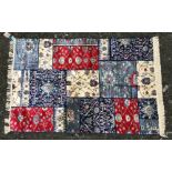 A blue and red ground Cashmere patchwork Rug