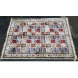 An Ivory ground Cashmere Carpet with Persian style panel decoration,